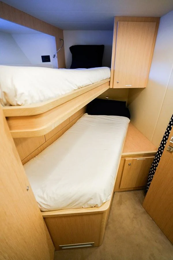 a room with two beds aboard TORO Yacht for Sale