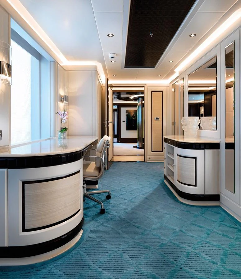 The yacht's interior features a luxurious hallway with elegant furnishings and modern decor. aboard JUST J'S Yacht for Sale