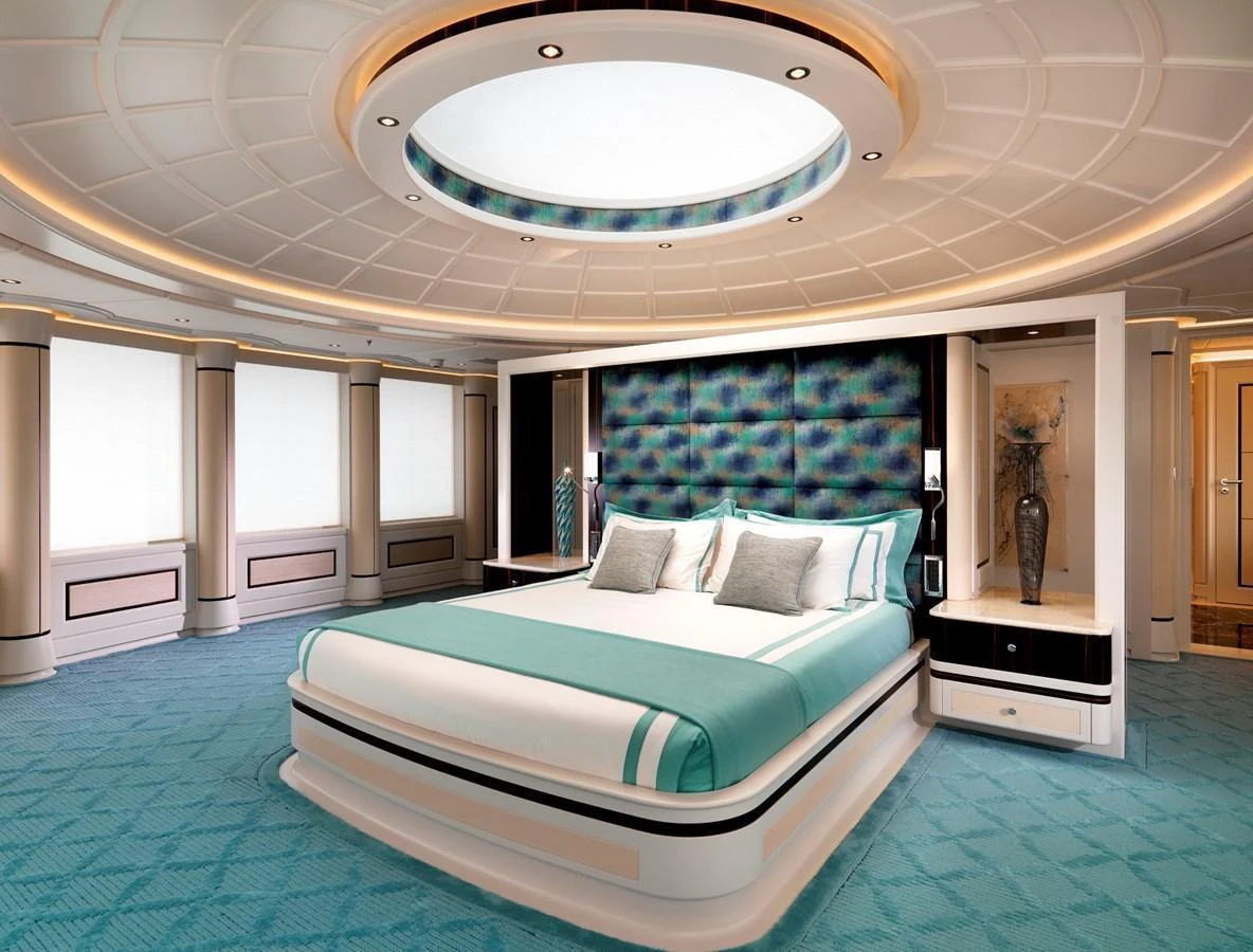The master stateroom features a luxurious bed with elegant decor and ample natural light. aboard JUST J'S Yacht for Sale