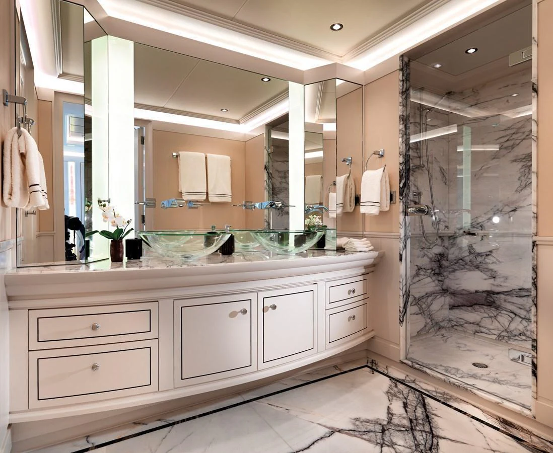 The yacht's bathroom features elegant marble finishes and modern fixtures. aboard JUST J'S Yacht for Sale