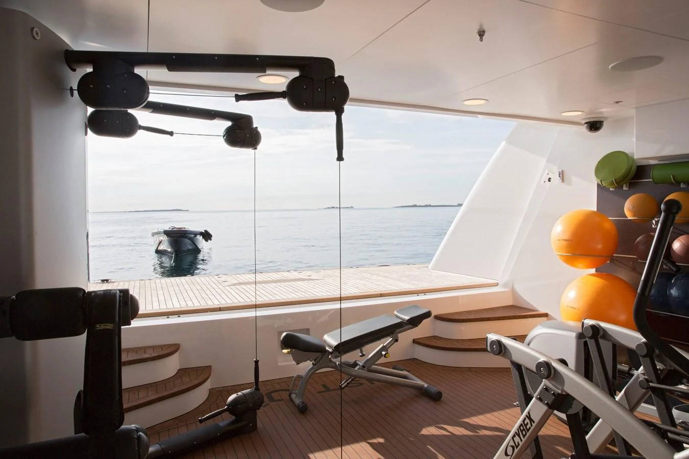 The yacht features a well-equipped gym with a stunning view of the sea. aboard JUST J'S Yacht for Sale