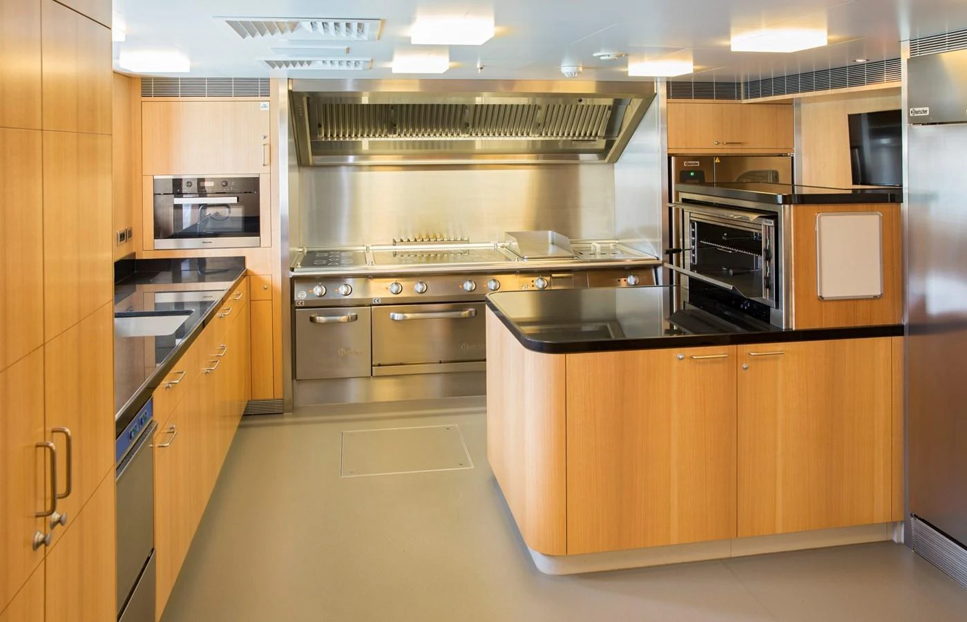 The yacht's galley is equipped with modern appliances and ample counter space for gourmet meal preparation. aboard JUST J'S Yacht for Sale