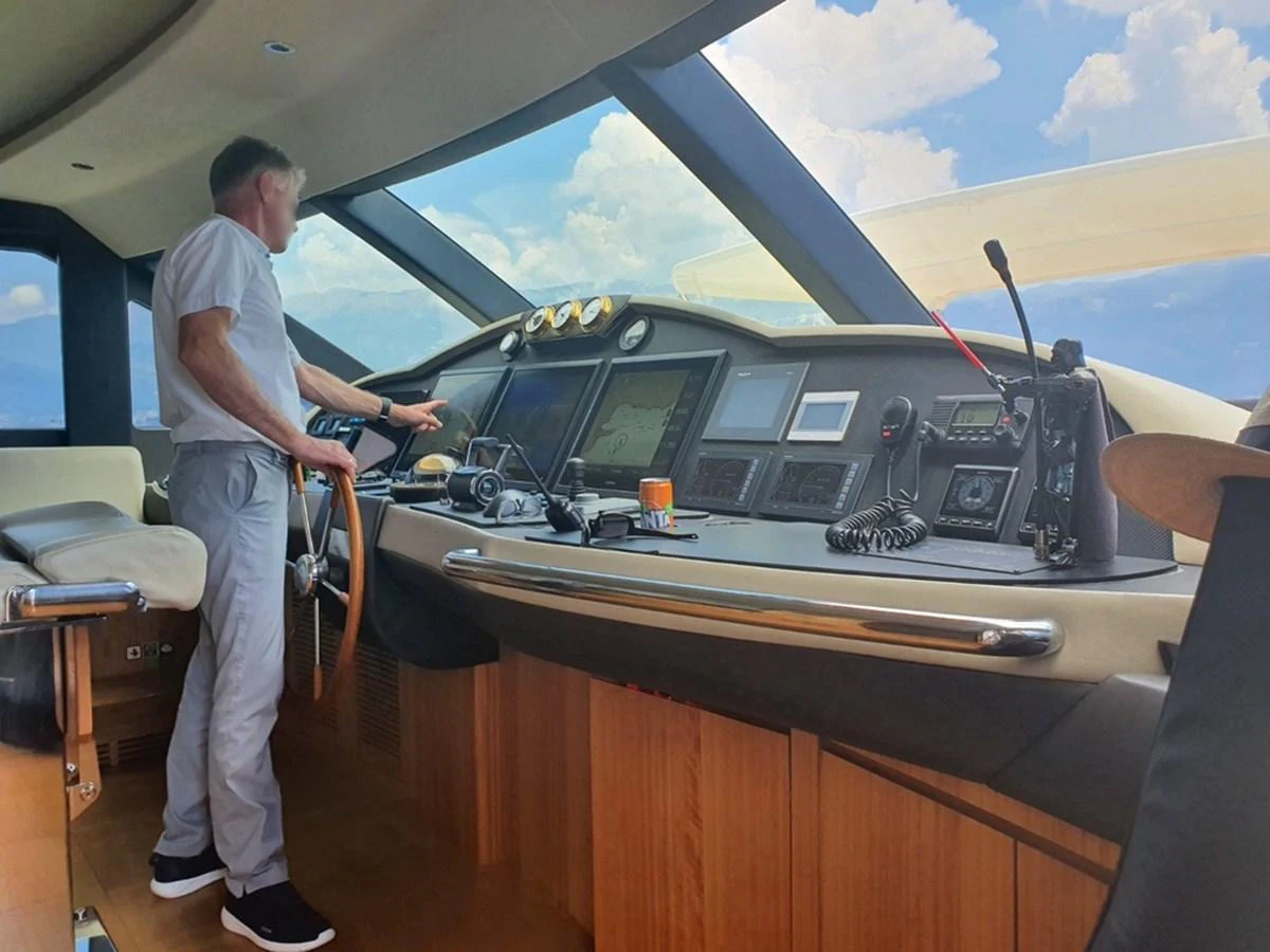 The helm station features advanced navigation equipment and a comfortable seating area, ensuring smooth sailing. aboard AMORE Yacht for Sale
