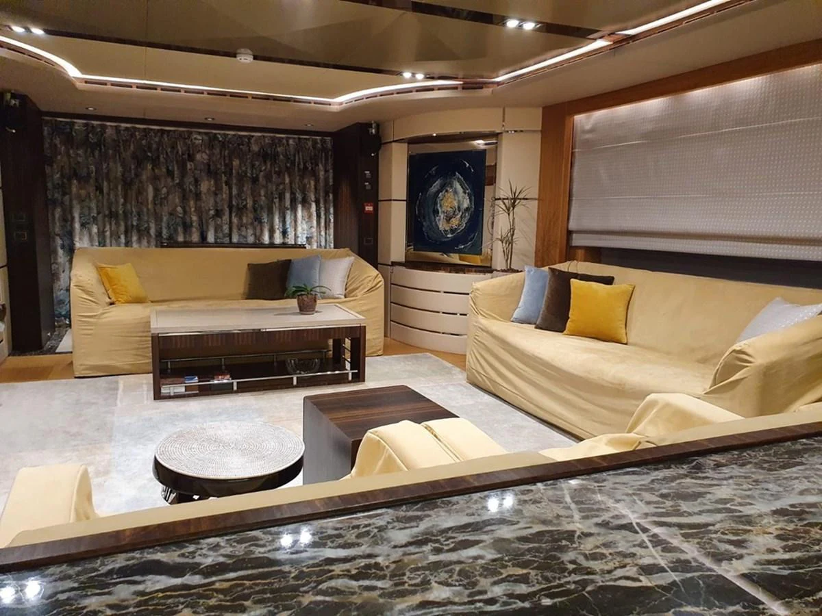 The salon features plush seating and elegant decor, creating a comfortable and stylish living space. aboard AMORE Yacht for Sale