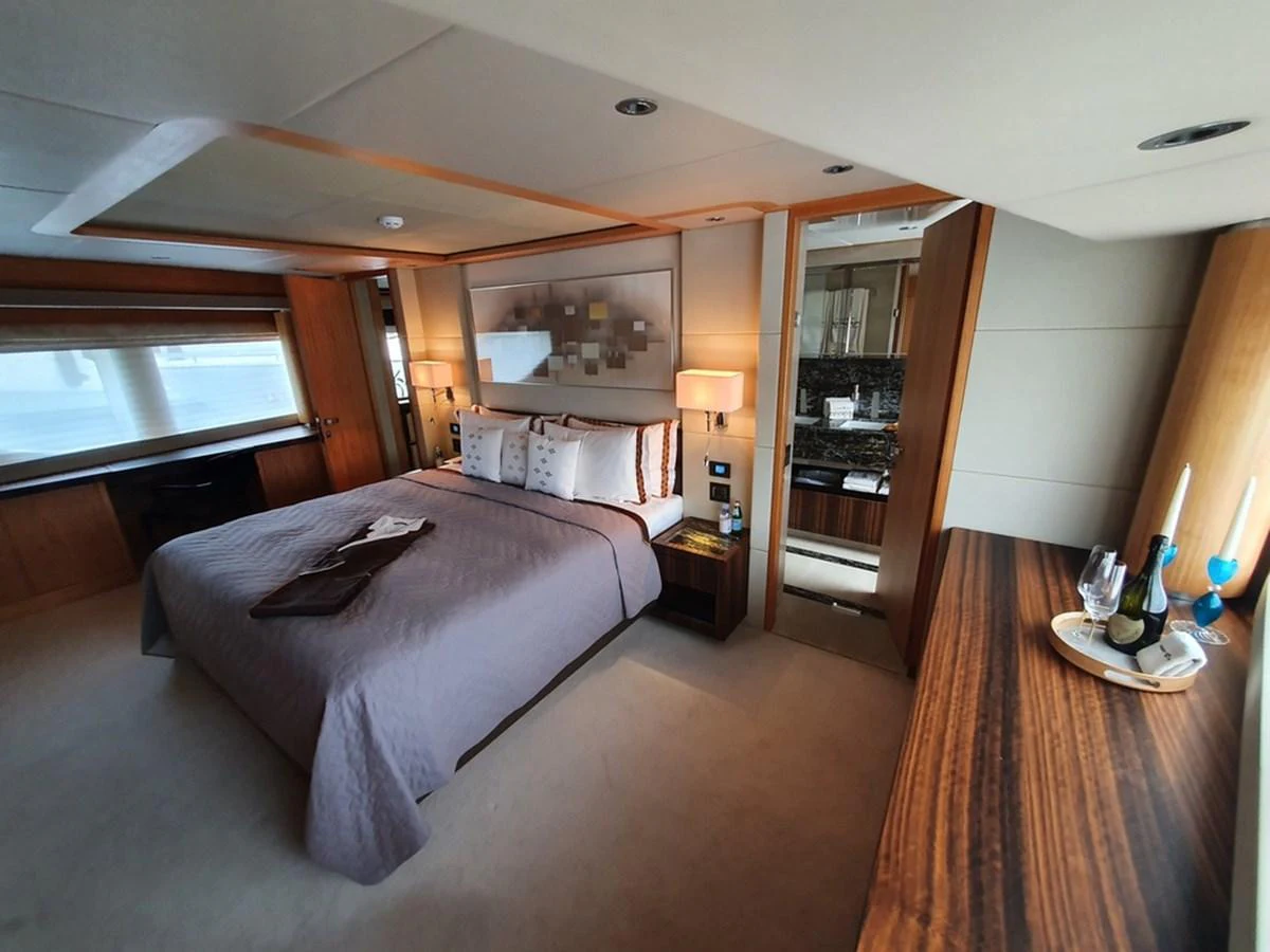 The master stateroom offers a luxurious and spacious retreat with elegant furnishings and ample natural light. aboard AMORE Yacht for Sale