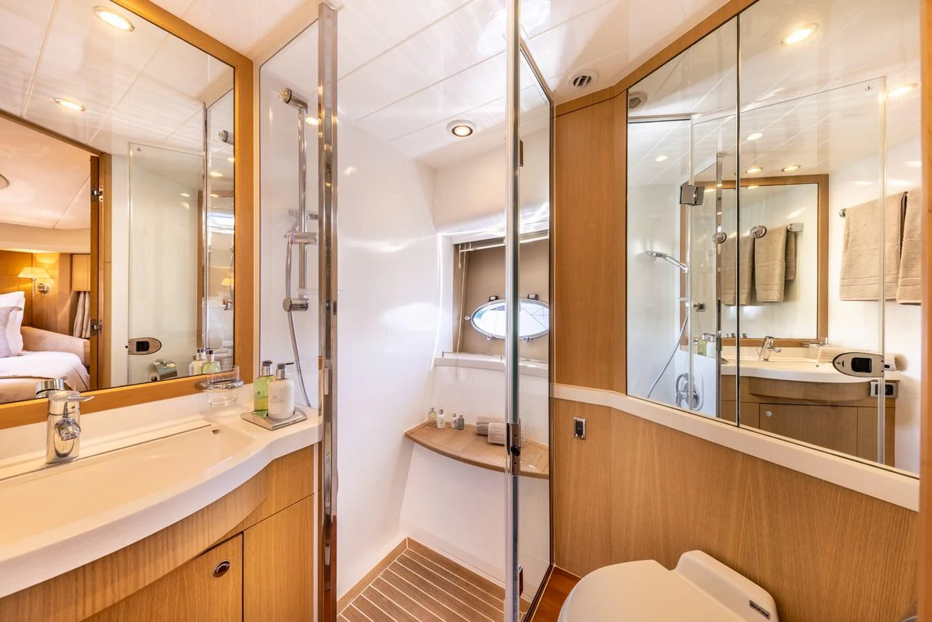 a bathroom with a large mirror aboard P'TITE BOUILLE Yacht for Sale