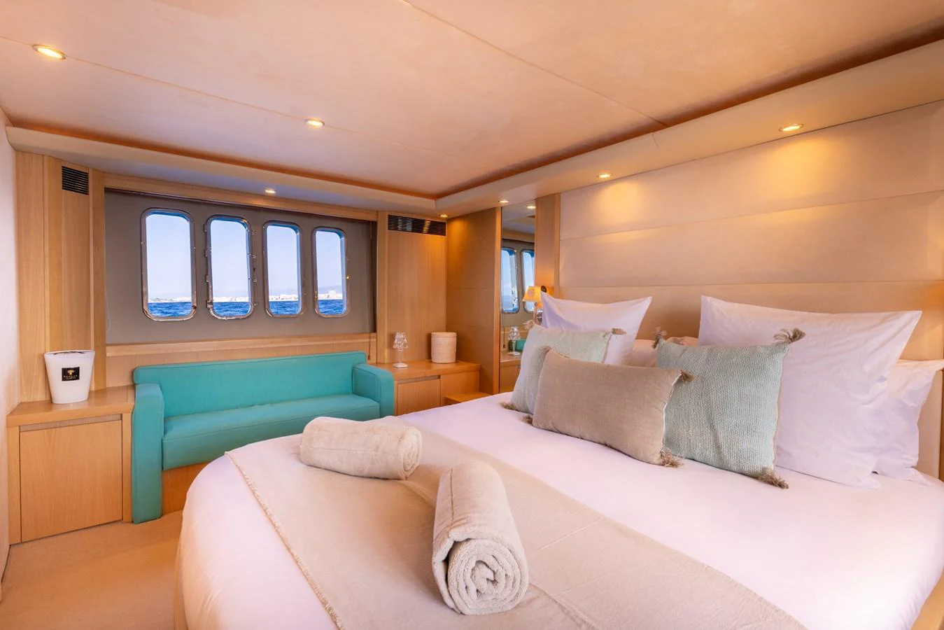 a bed with a white bed aboard P'TITE BOUILLE Yacht for Sale