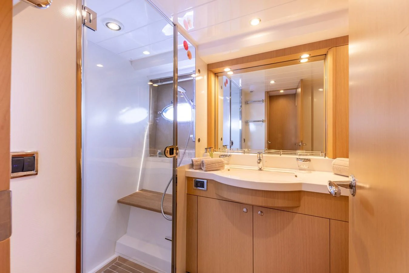 a bathroom with a shower unit and sink aboard P'TITE BOUILLE Yacht for Sale