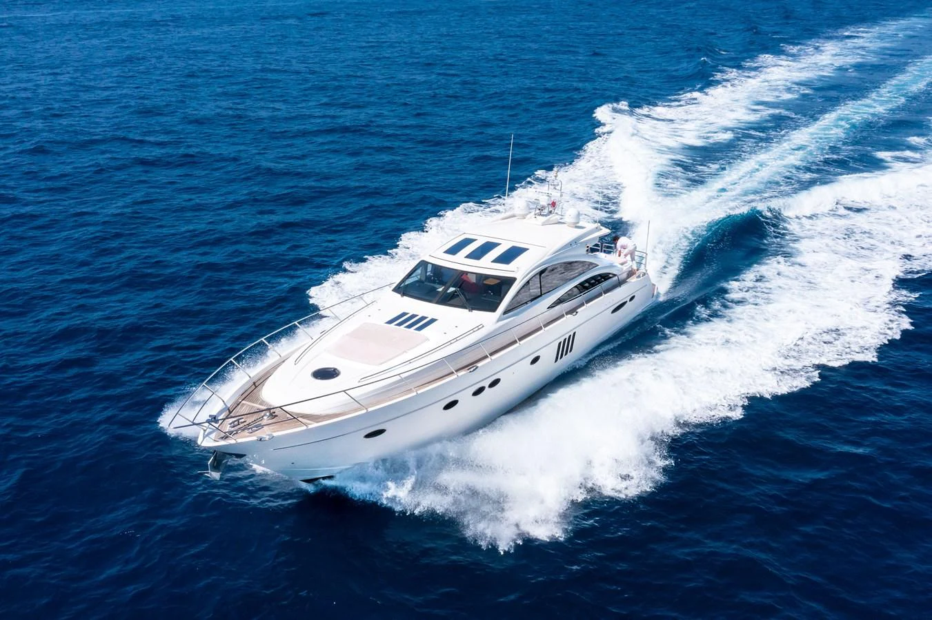 a white yacht on the water aboard P'TITE BOUILLE Yacht for Sale
