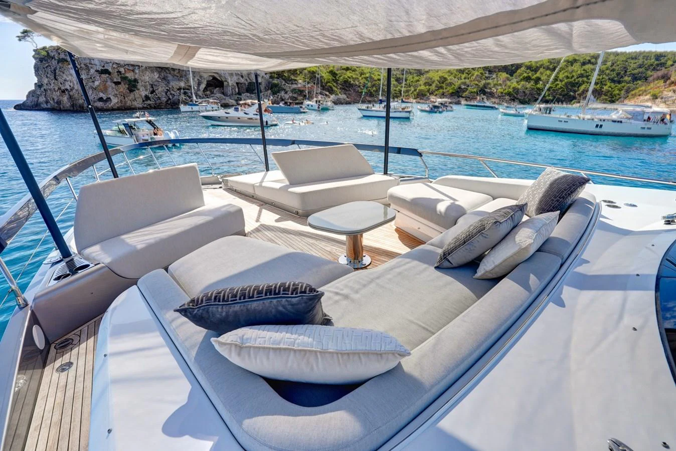 The flybridge offers a luxurious lounging area with ample seating and stunning views of the surrounding waters. aboard APRICITY Yacht for Sale