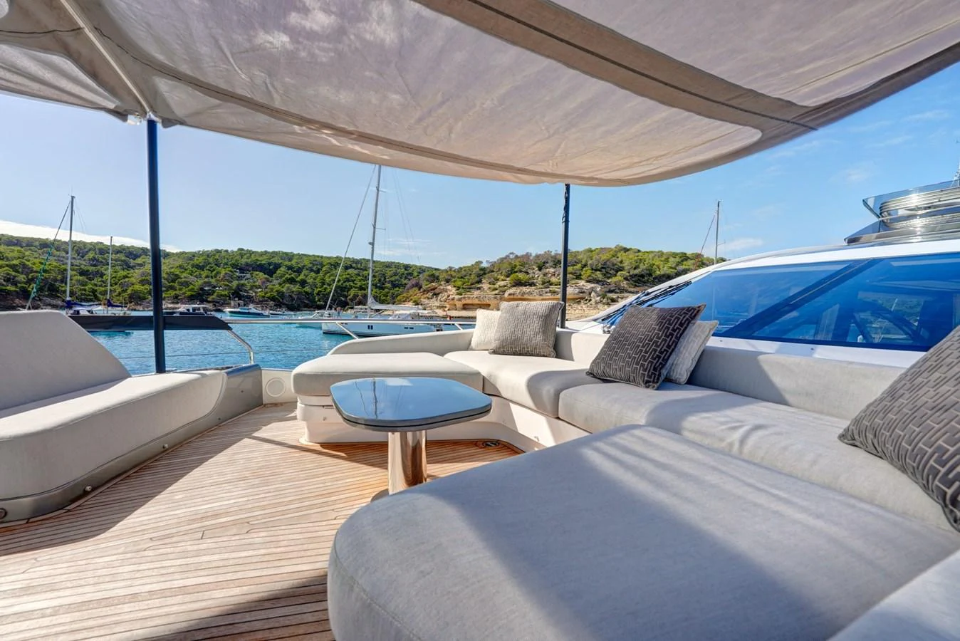 The aft deck offers a spacious and comfortable lounging area with a scenic view of the surrounding waters. aboard APRICITY Yacht for Sale