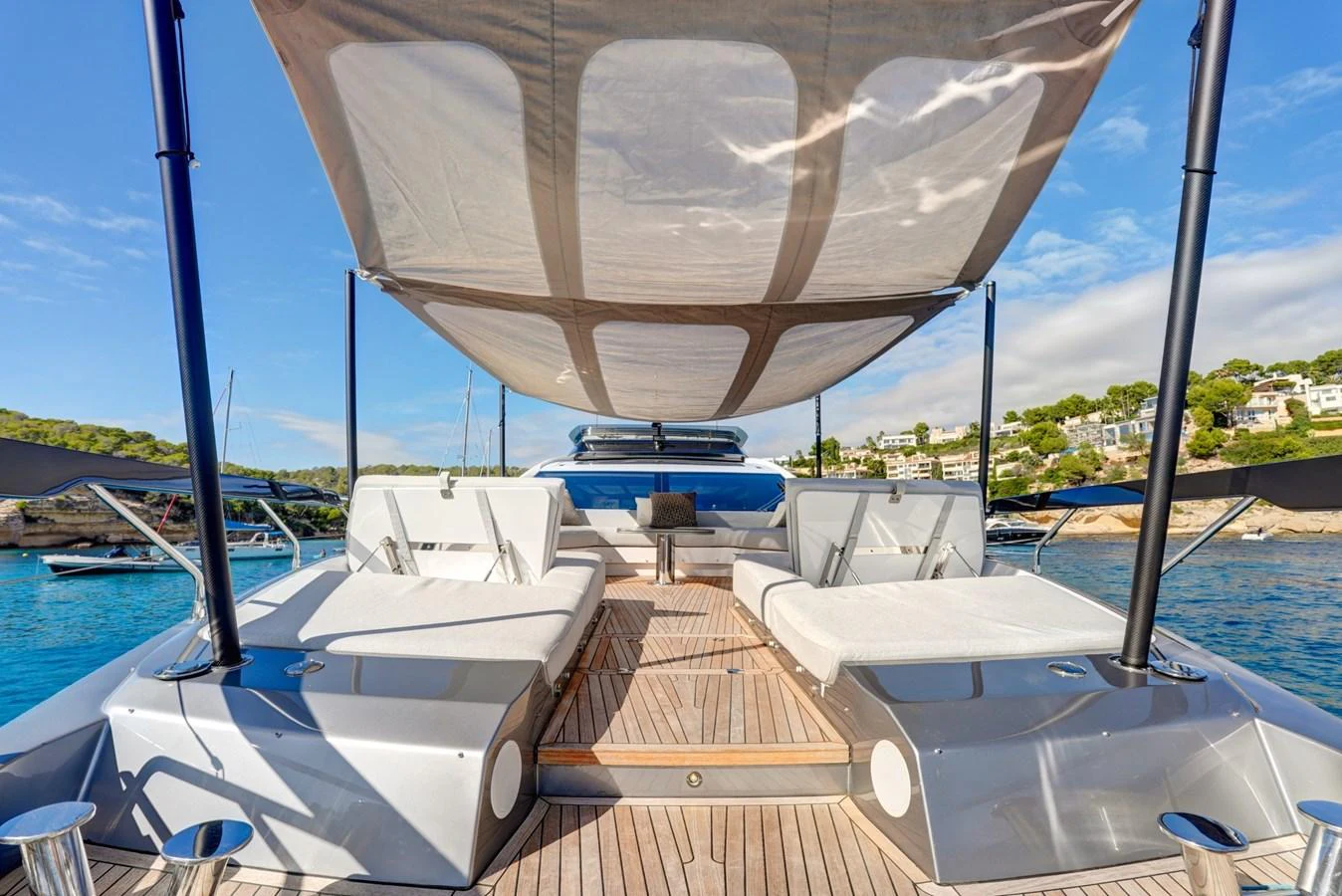 The sundeck features luxurious sun loungers under a stylish canopy, perfect for relaxation. aboard APRICITY Yacht for Sale