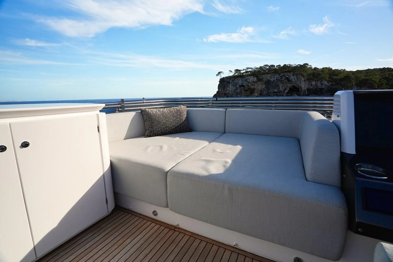 A comfortable sundeck area with plush seating and scenic ocean views. aboard APRICITY Yacht for Sale