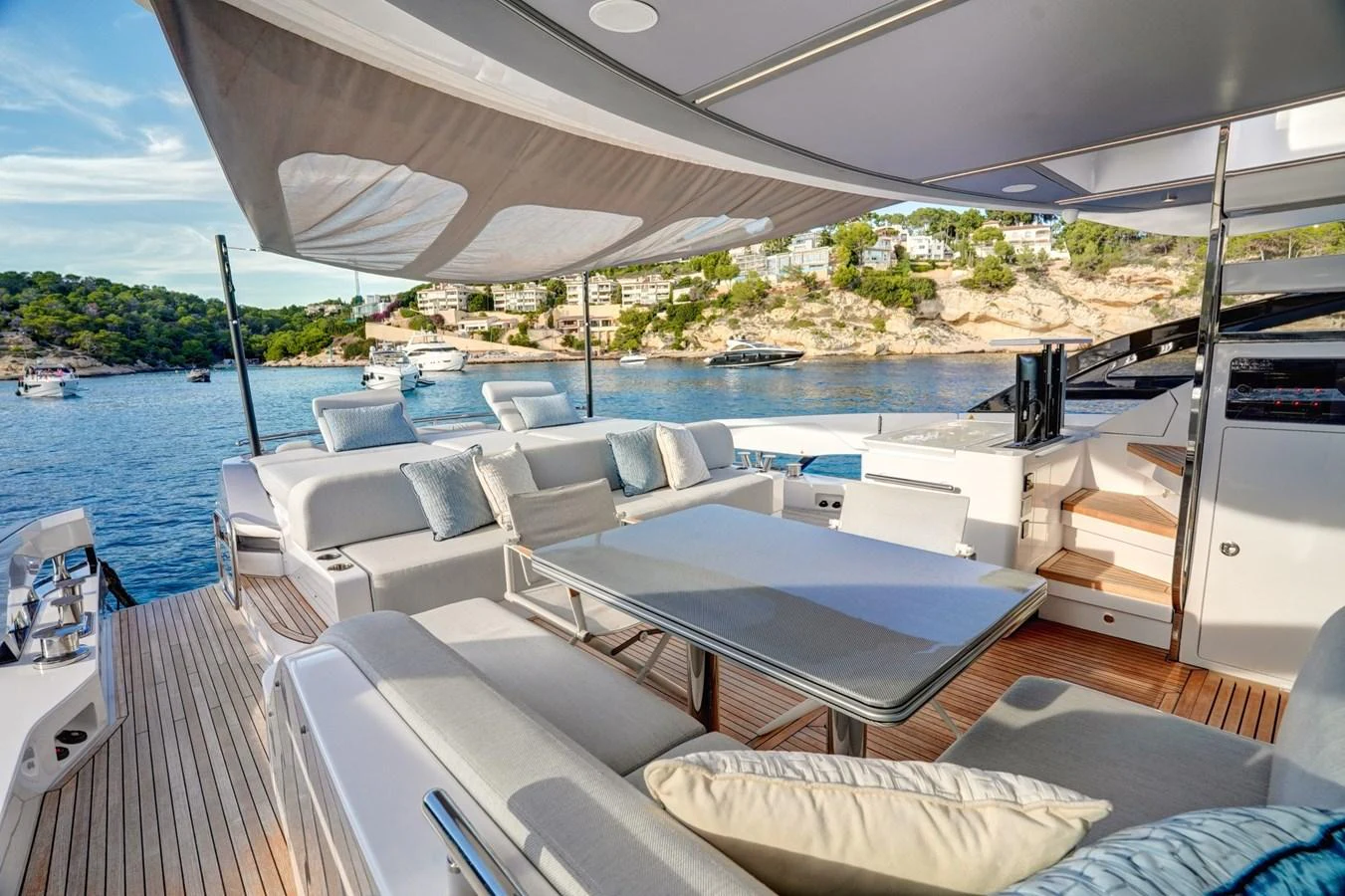 The aft deck offers a luxurious outdoor seating area with stunning views of the surrounding waters. aboard APRICITY Yacht for Sale