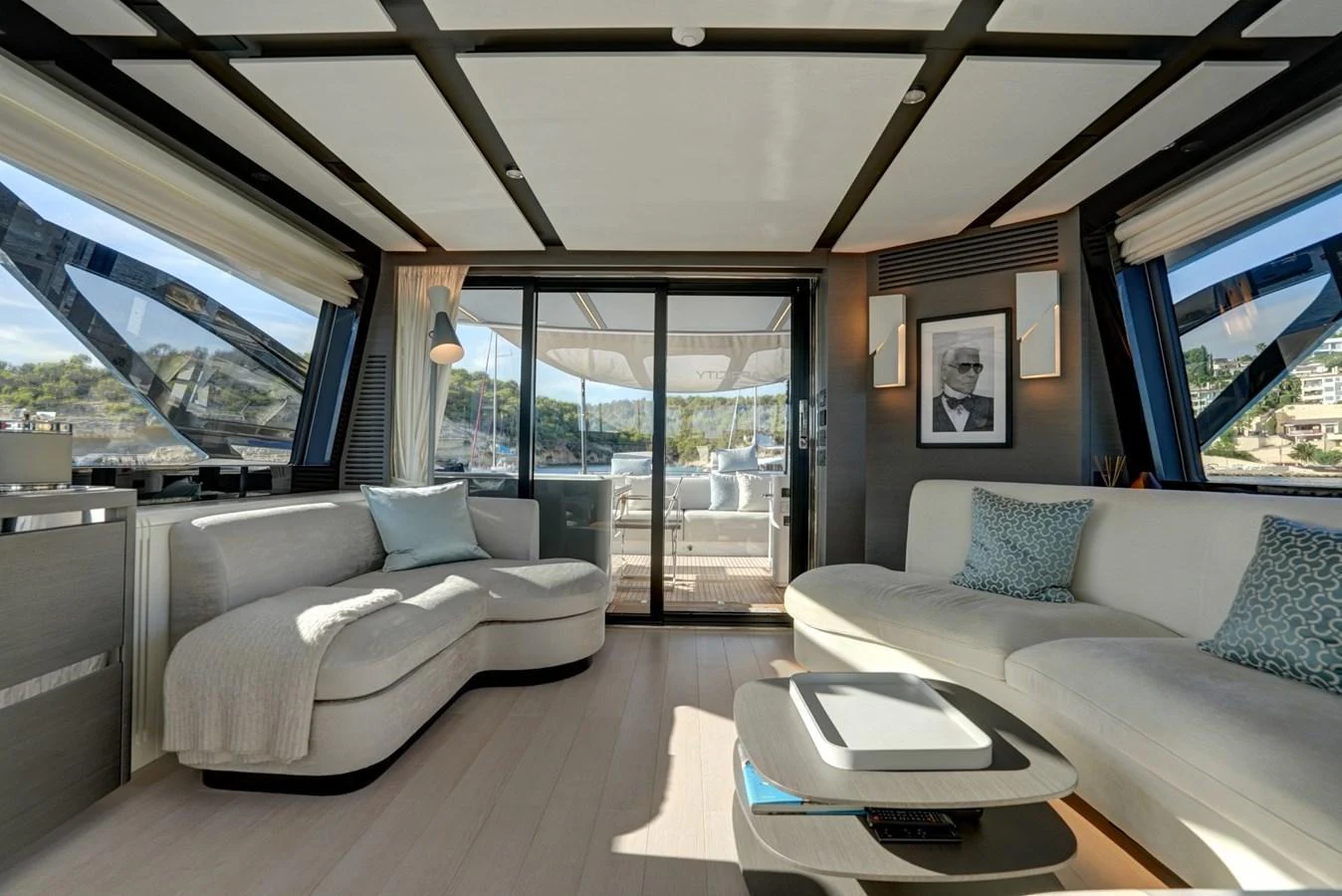 The salon features elegant seating with large windows offering stunning views. aboard APRICITY Yacht for Sale