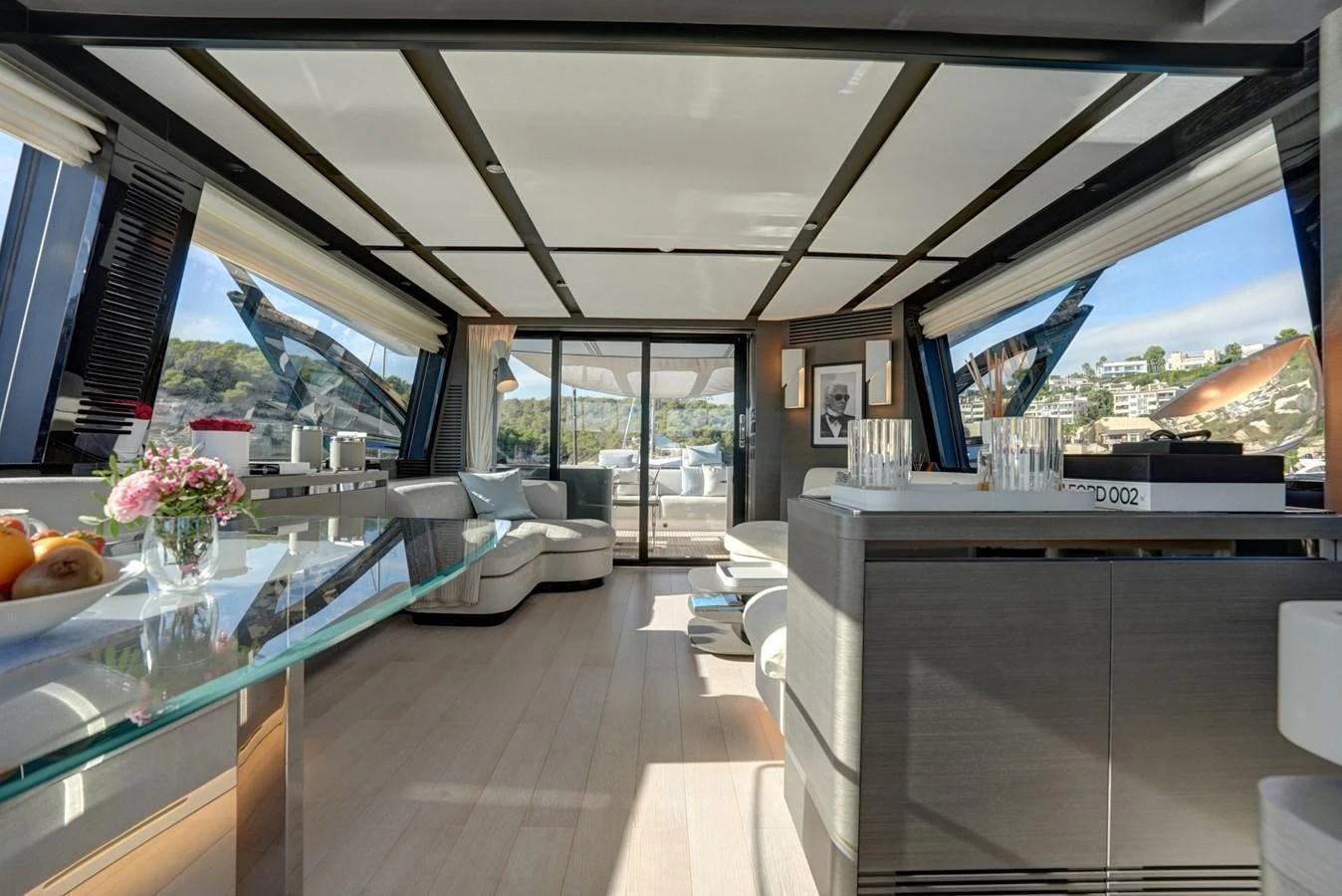 The yacht's salon features a spacious and modern design with ample natural light and luxurious furnishings. aboard APRICITY Yacht for Sale