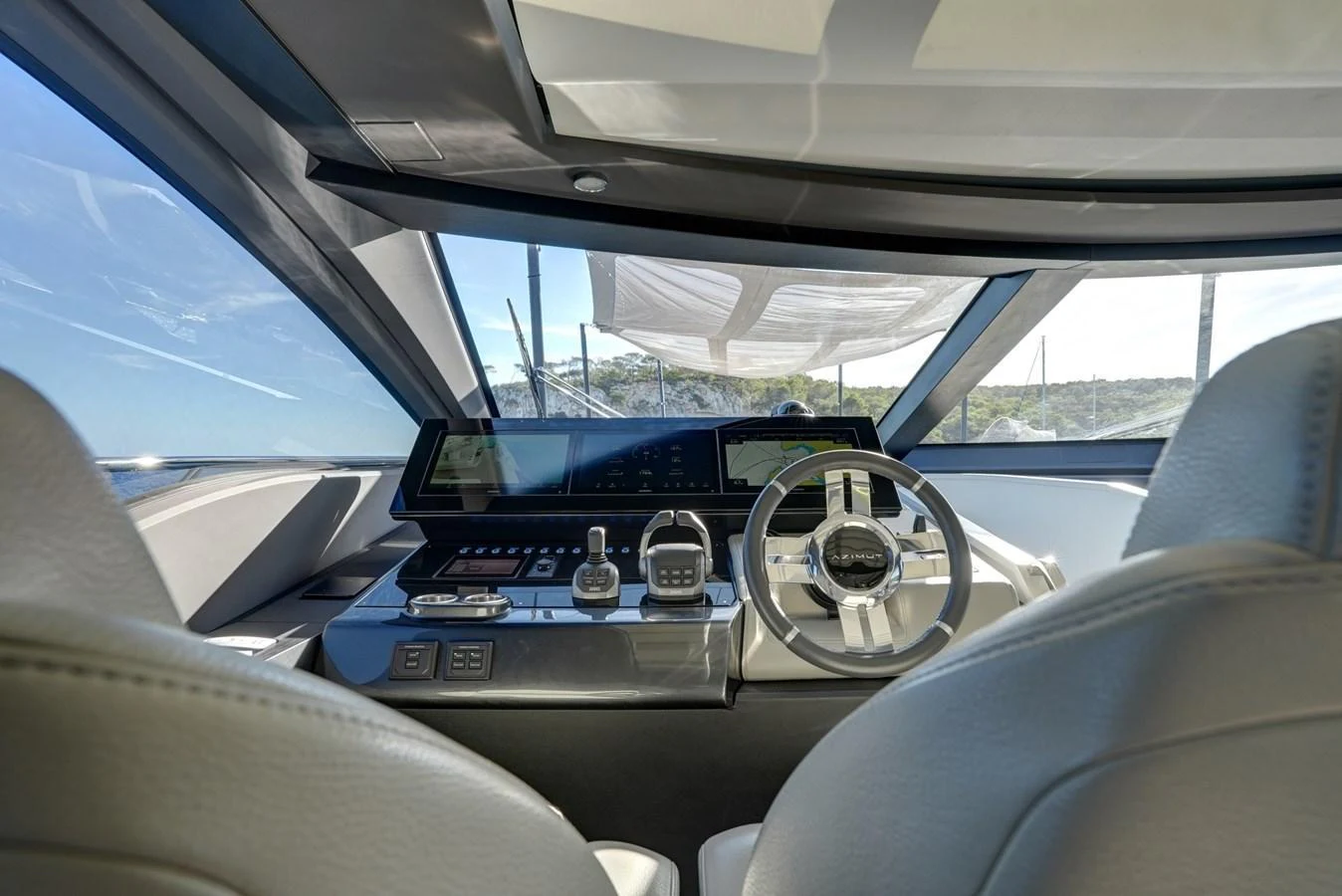 The helm station offers a sleek and modern design with advanced navigation equipment. aboard APRICITY Yacht for Sale