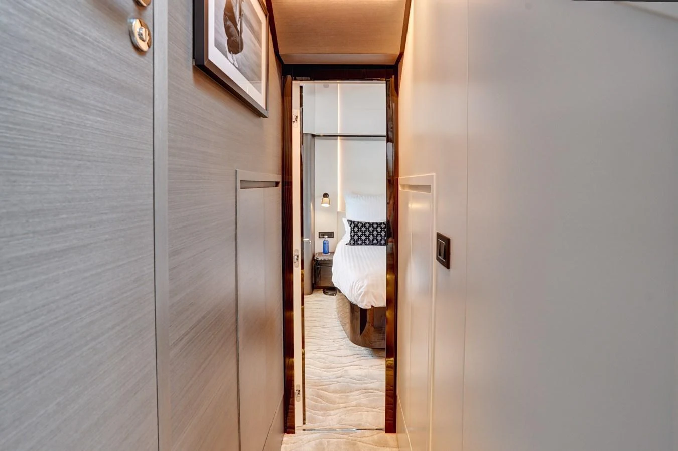 A cozy hallway leads to a well-appointed stateroom with modern decor. aboard APRICITY Yacht for Sale