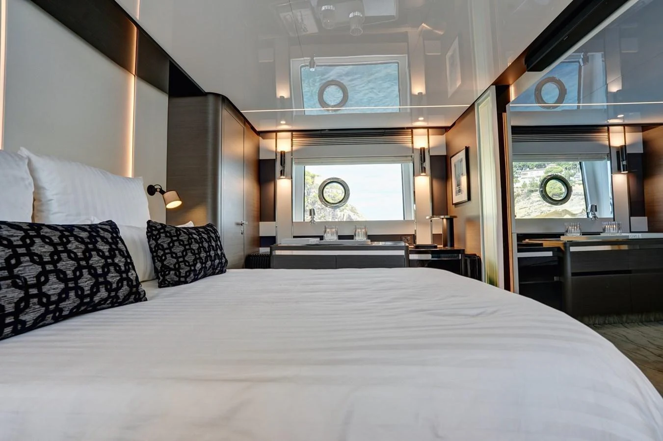 A luxurious stateroom featuring a comfortable bed and modern decor. aboard APRICITY Yacht for Sale