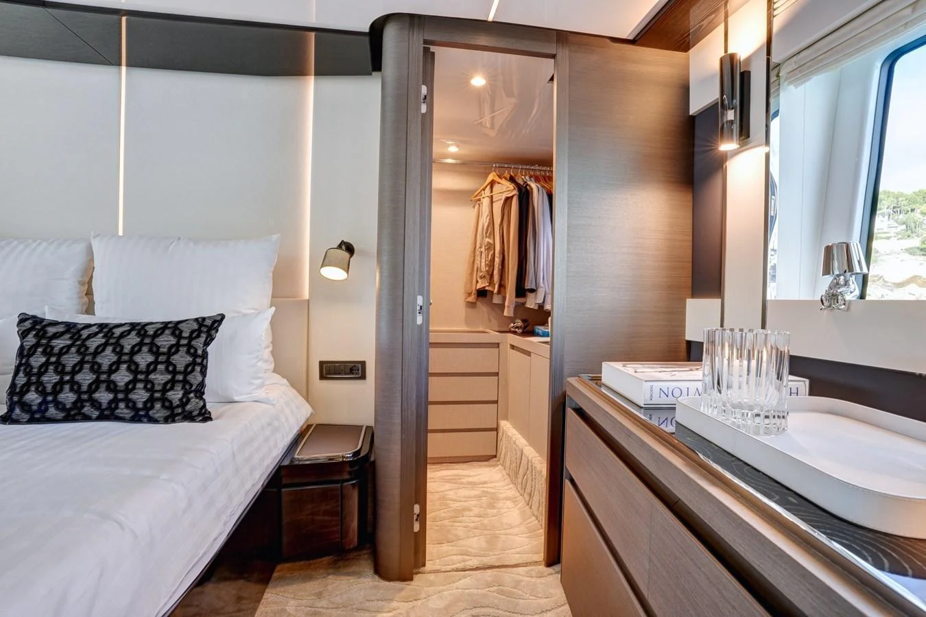 The stateroom features a cozy bed, a walk-in closet, and elegant decor. aboard APRICITY Yacht for Sale
