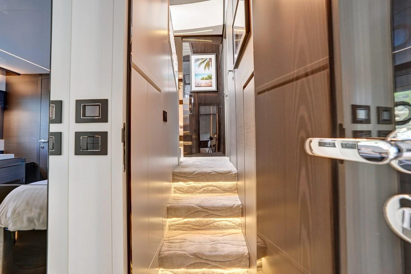 A luxurious hallway with illuminated steps leading to the upper deck. aboard APRICITY Yacht for Sale