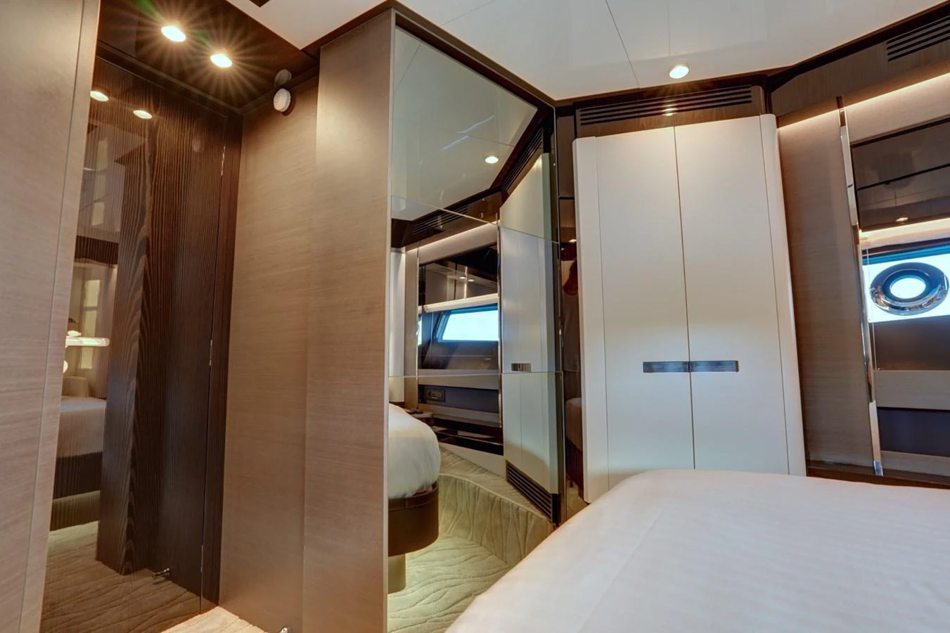 A luxurious stateroom with modern design and ample lighting. aboard APRICITY Yacht for Sale