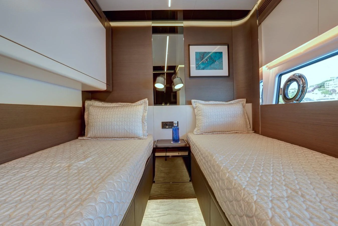 The twin stateroom features two comfortable single beds with elegant bedding and modern decor. aboard APRICITY Yacht for Sale