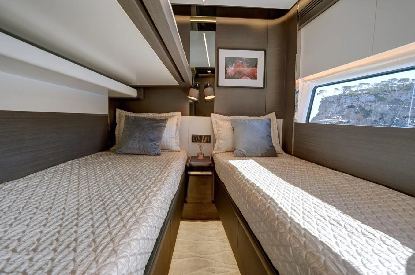The twin stateroom offers a cozy and elegant sleeping area with two single beds and tasteful decor. aboard APRICITY Yacht for Sale