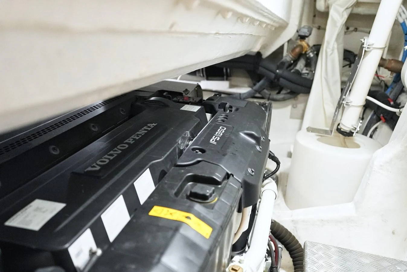 The image showcases the engine room featuring a Volvo Penta engine. aboard APRICITY Yacht for Sale