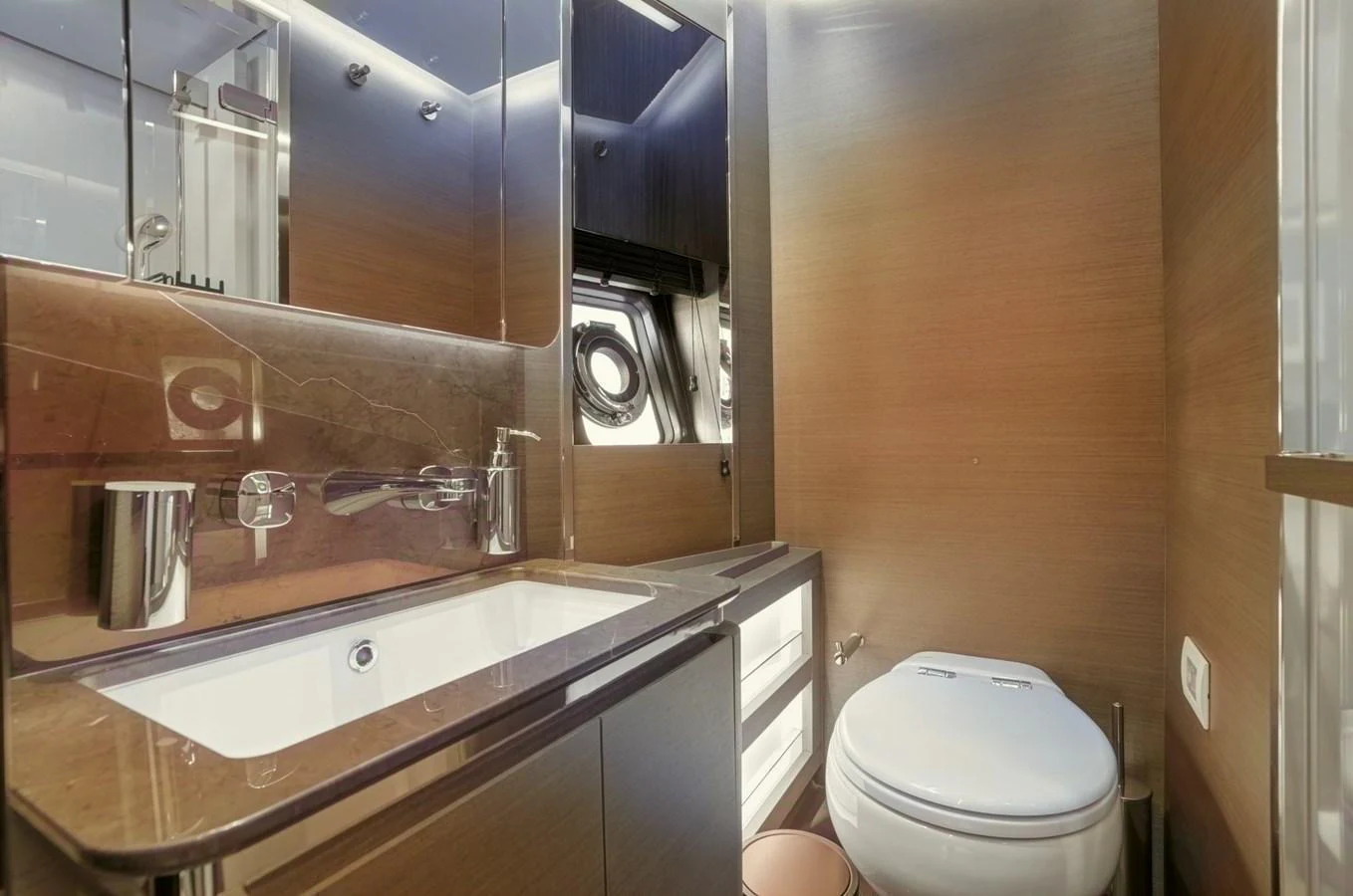 The yacht's head features modern fixtures and a sleek design. aboard APRICITY Yacht for Sale