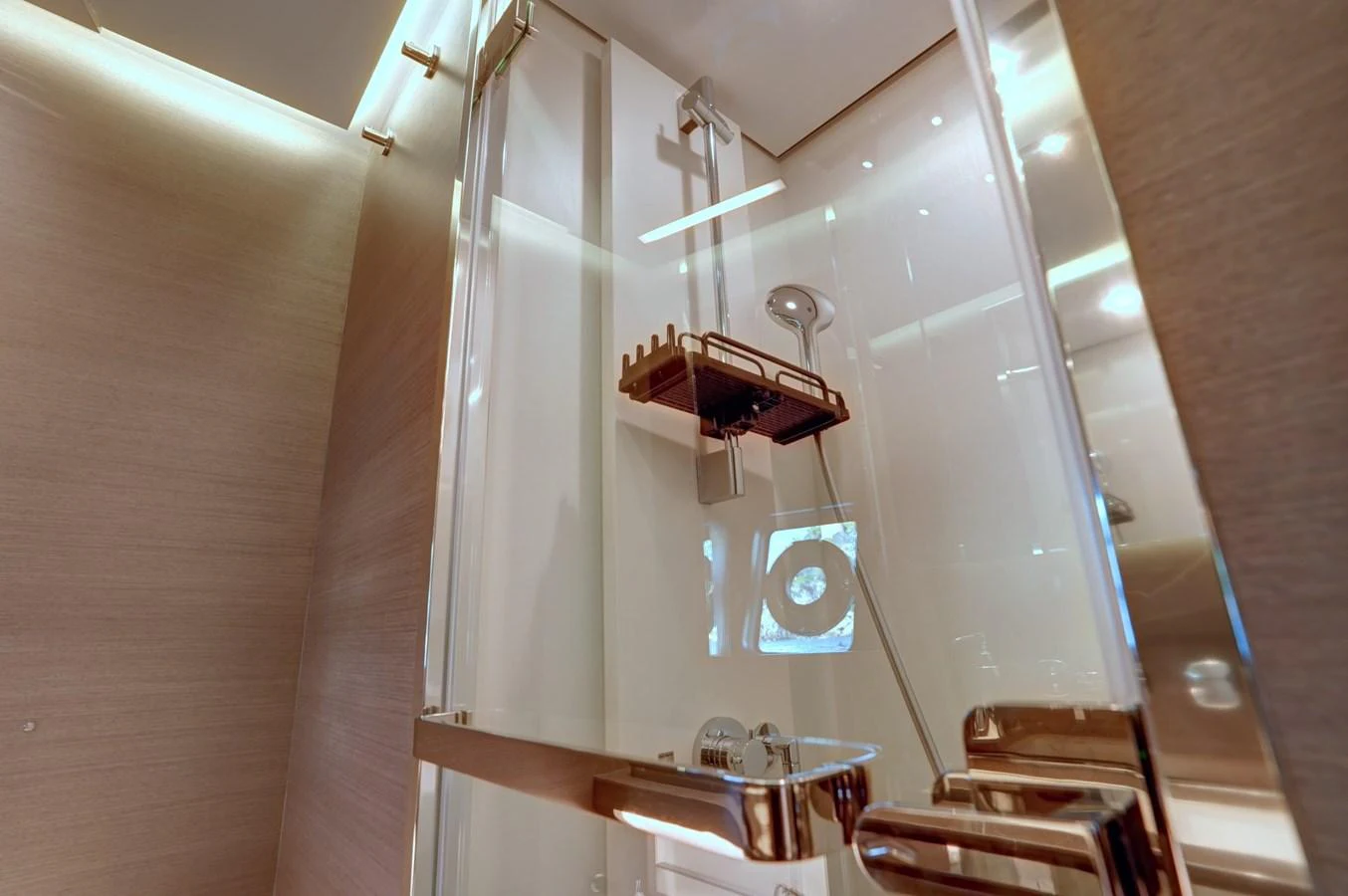 A sleek and modern shower area with glass doors and chrome fixtures. aboard APRICITY Yacht for Sale