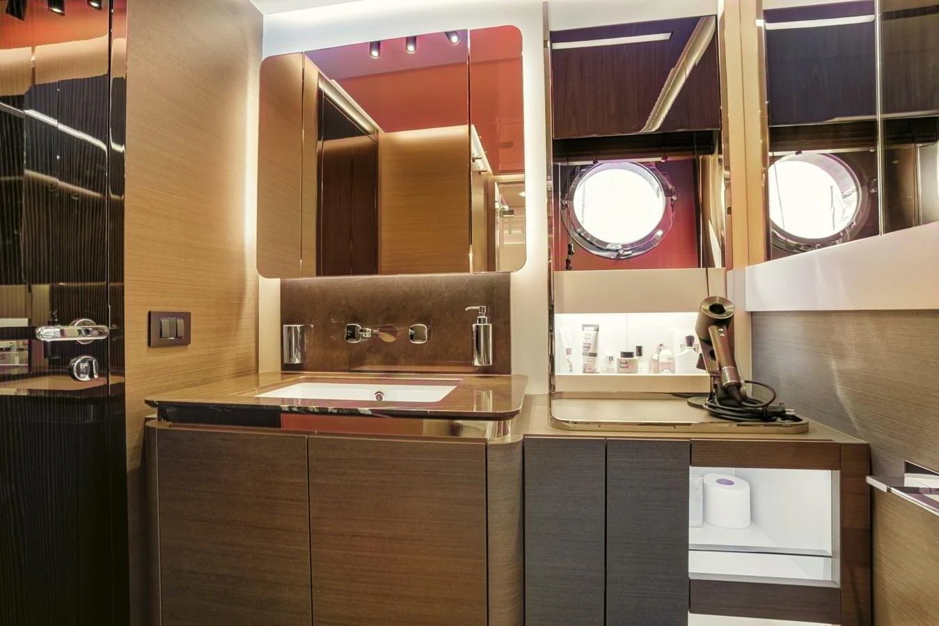 The yacht's bathroom features modern fixtures and a sleek design with ample storage space. aboard APRICITY Yacht for Sale