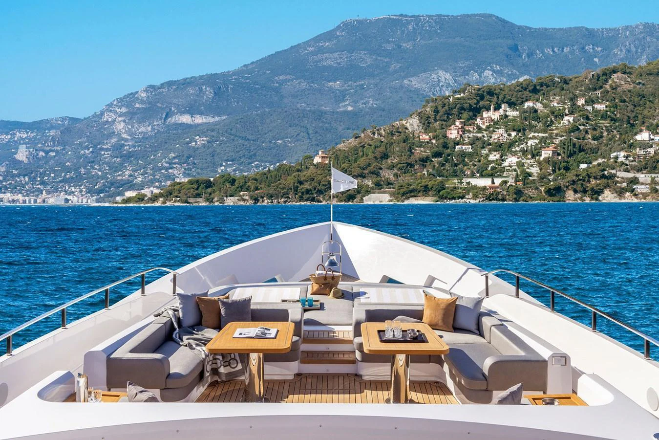 The yacht's foredeck features a luxurious seating area with stunning views of the surrounding landscape. aboard MIOTU Yacht for Sale