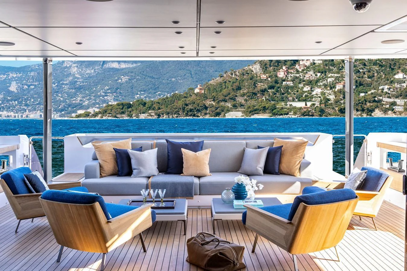 The aft deck features a spacious seating area with a stunning view of the water and surrounding landscape. aboard MIOTU Yacht for Sale