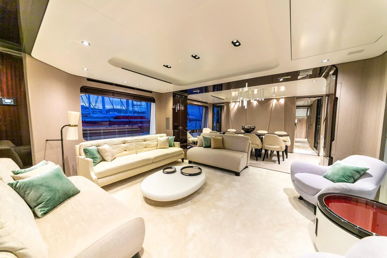 The salon features luxurious seating with elegant decor and ample natural light. aboard NIRVANA BY THE SEA Yacht for Sale