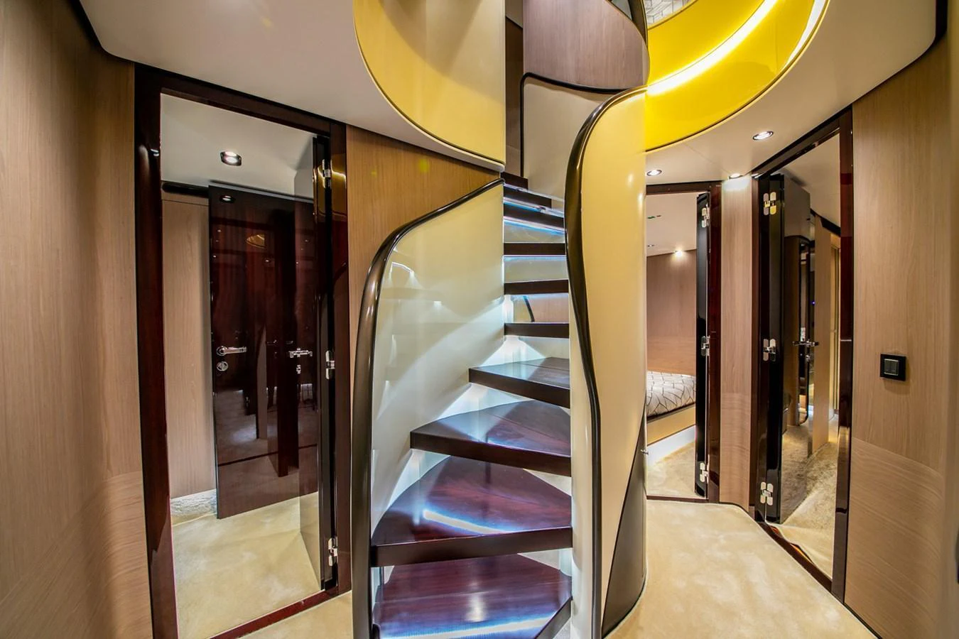 A luxurious interior staircase with modern design elements and ambient lighting. aboard NIRVANA BY THE SEA Yacht for Sale