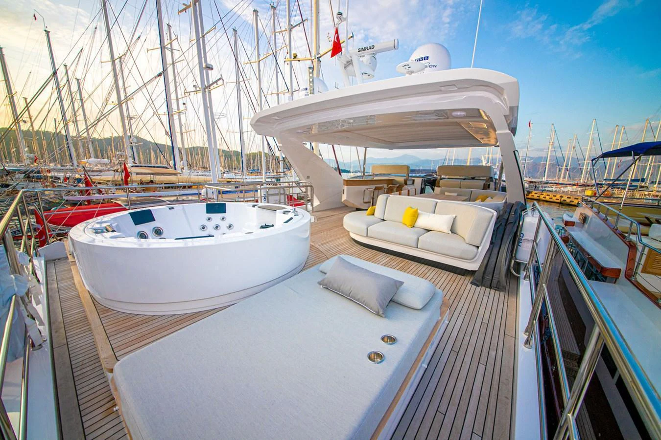 The sundeck features a luxurious jacuzzi and comfortable lounging areas, perfect for relaxation. aboard NIRVANA BY THE SEA Yacht for Sale
