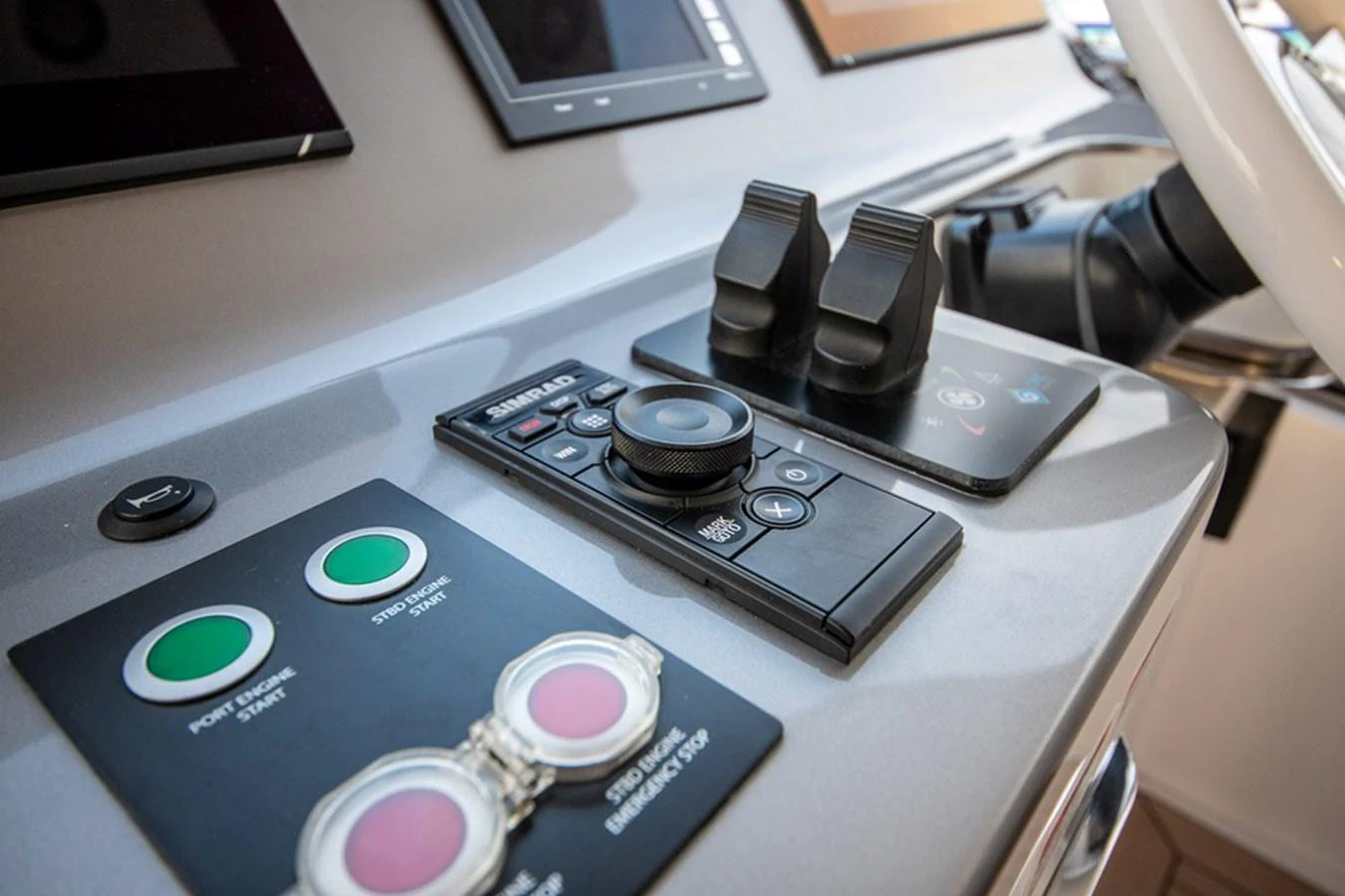 A close-up view of the yacht's helm showcasing advanced navigation and control systems. aboard NIRVANA BY THE SEA Yacht for Sale