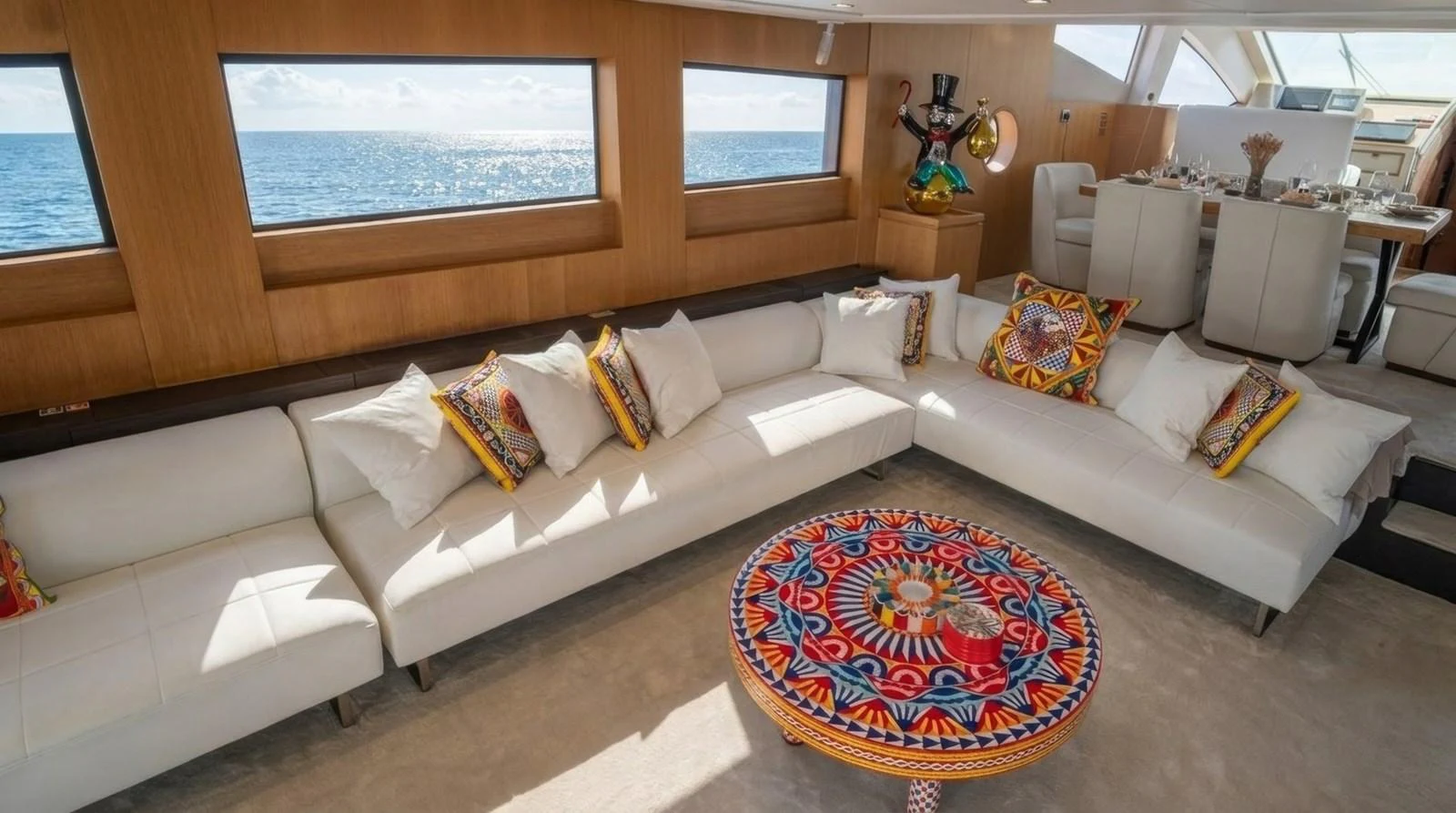 The salon features a spacious and stylish seating area with vibrant decor and panoramic ocean views. aboard TAYGET Yacht for Sale