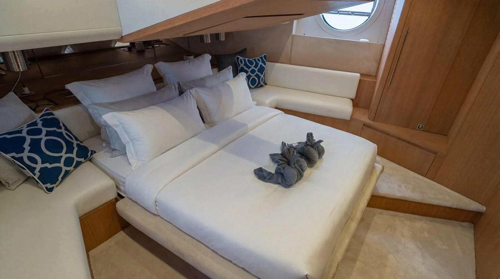 The stateroom features a comfortable bed with plush pillows and stylish decor. aboard TAYGET Yacht for Sale