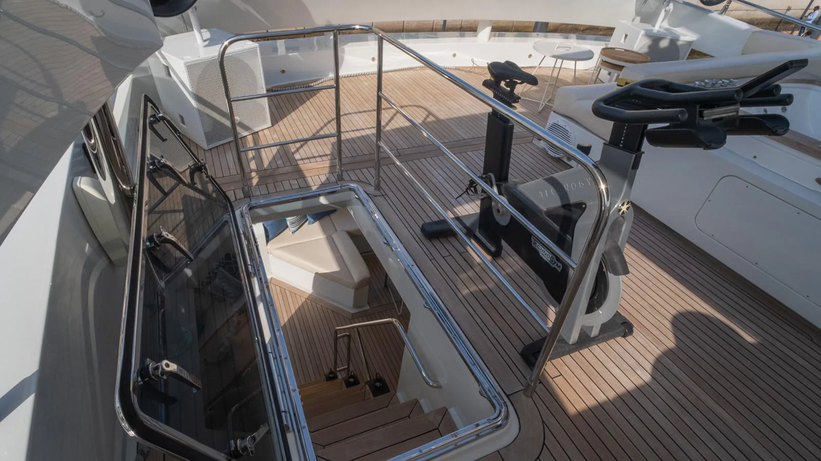 A well-designed stairway on the yacht leads to the lower deck, featuring polished railings and a clean, modern aesthetic. aboard TAYGET Yacht for Sale