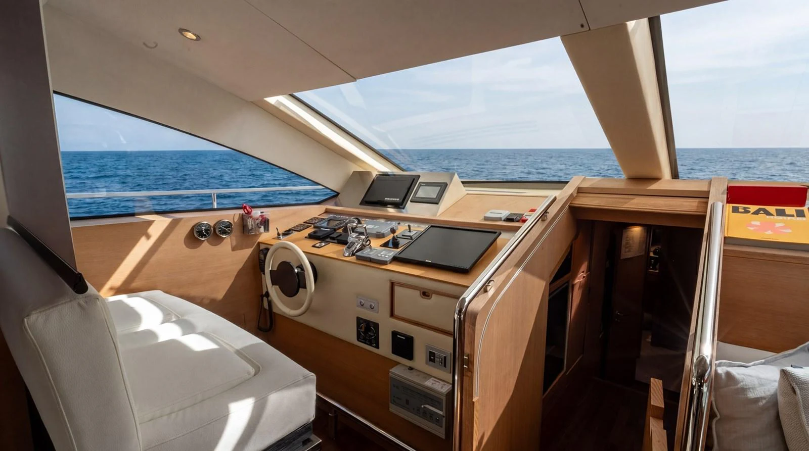 The helm station offers a commanding view with state-of-the-art navigation equipment and luxurious seating. aboard TAYGET Yacht for Sale
