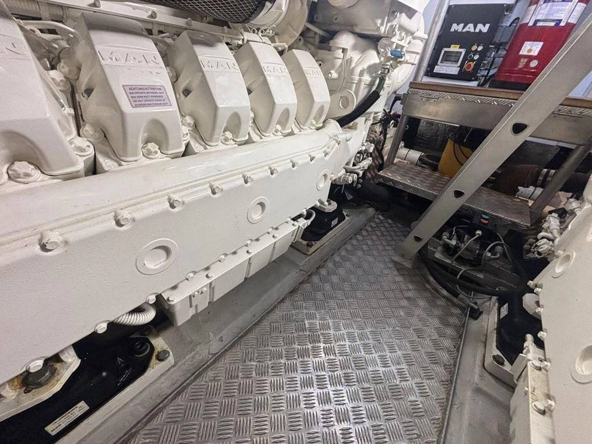 The engine room showcases powerful machinery and well-organized components. aboard M/Y TITAN Yacht for Sale