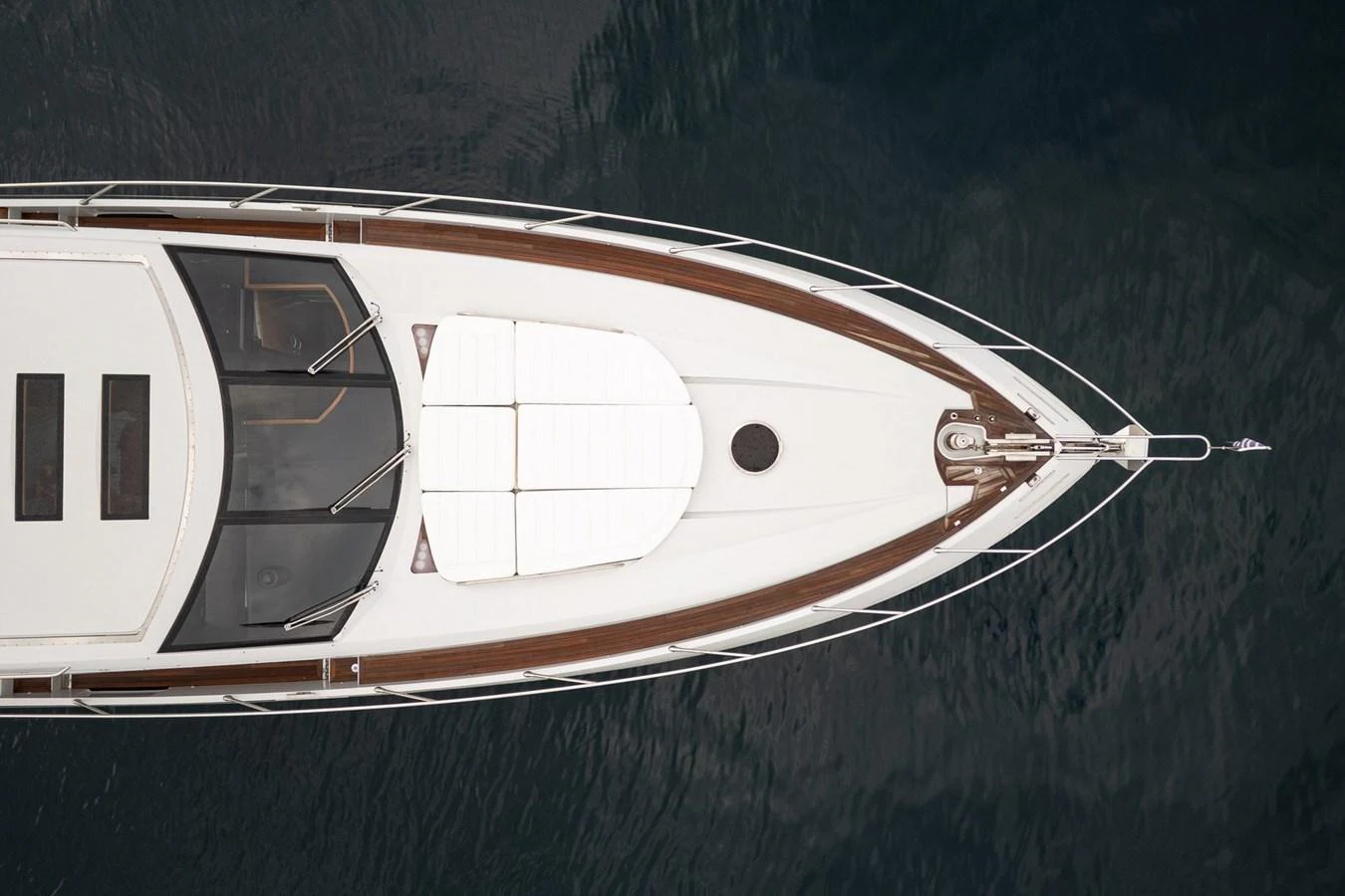 The foredeck of the yacht features sleek lines and a spacious sunbathing area. aboard M/Y TITAN Yacht for Sale