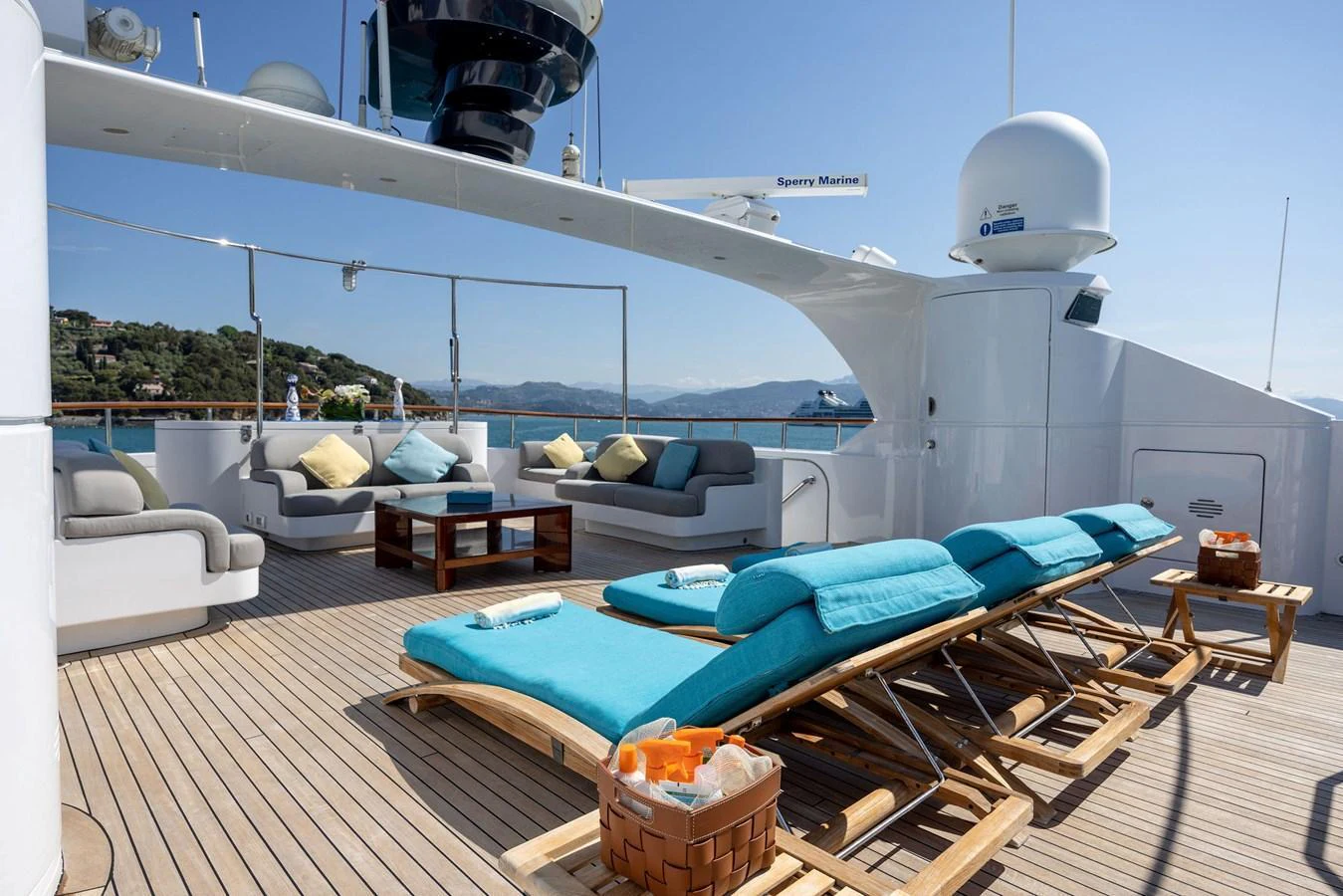 The sundeck offers a luxurious space with sun loungers and comfortable seating, perfect for relaxation. aboard HOLIDAY Yacht for Sale