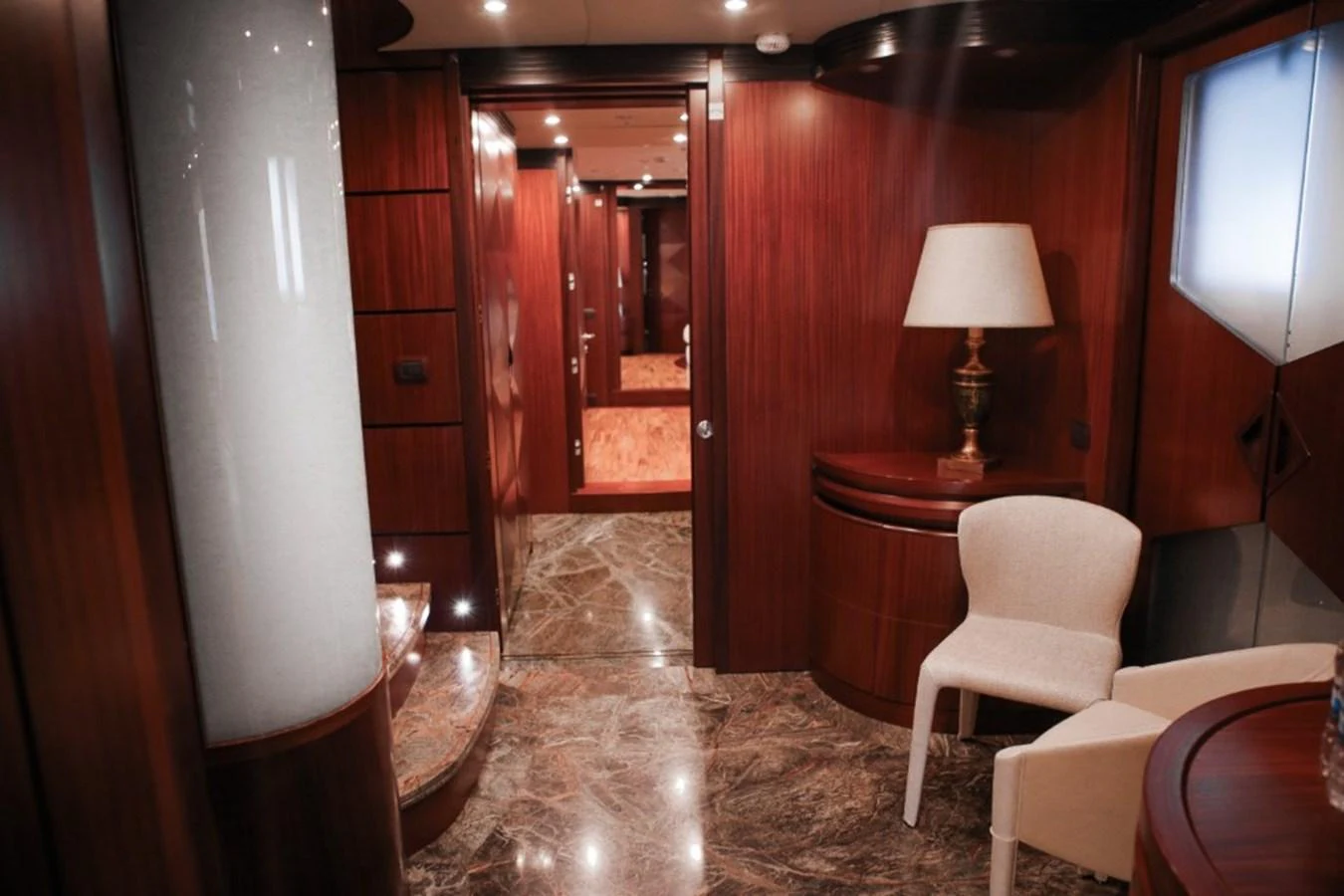 The yacht's interior features elegant wood paneling and luxurious marble flooring. aboard HOLIDAY Yacht for Sale