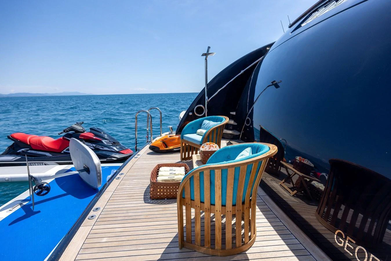 The aft deck features comfortable seating with a stunning view of the sea. aboard HOLIDAY Yacht for Sale