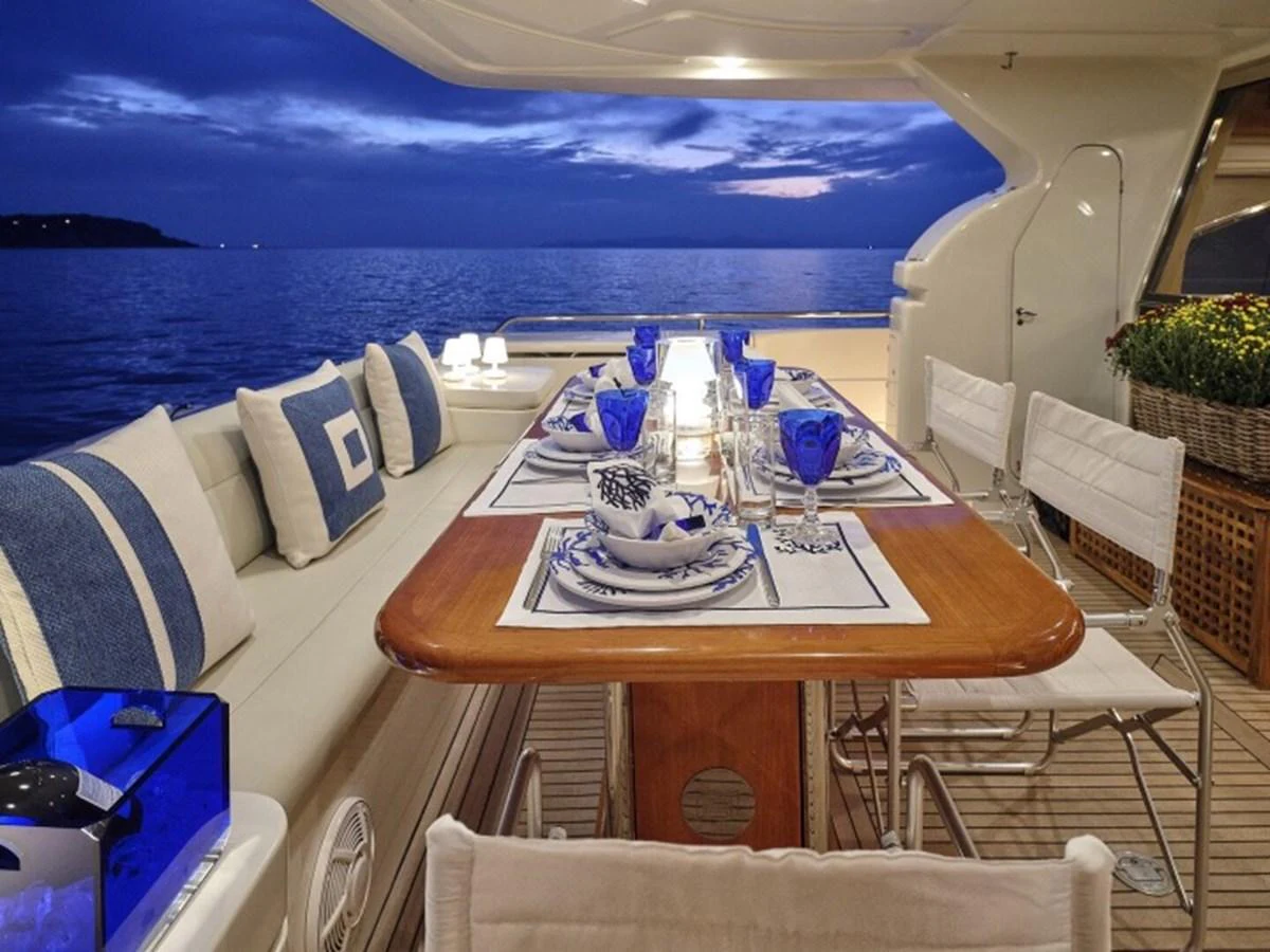a table with candles on it aboard MIREN Yacht for Sale