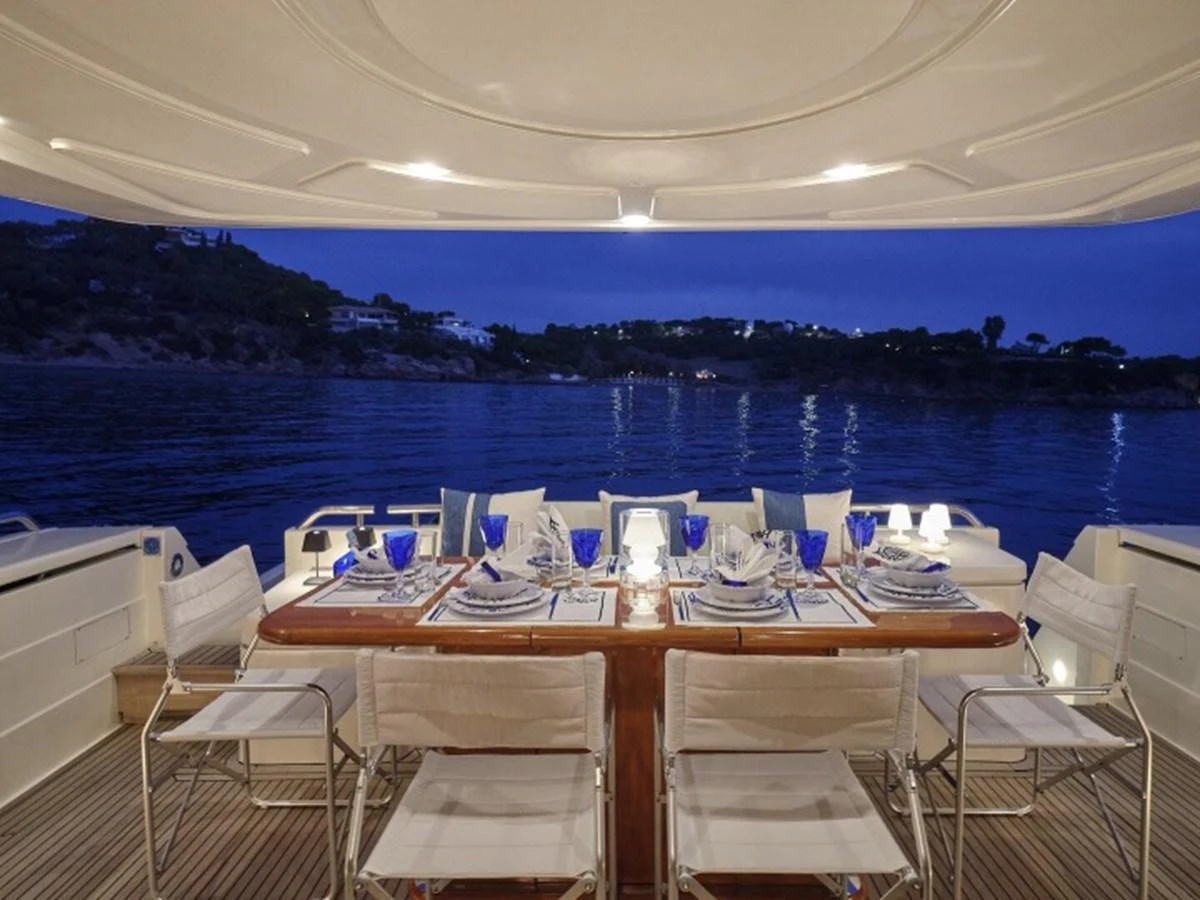 a table set for a dinner on a boat aboard MIREN Yacht for Sale