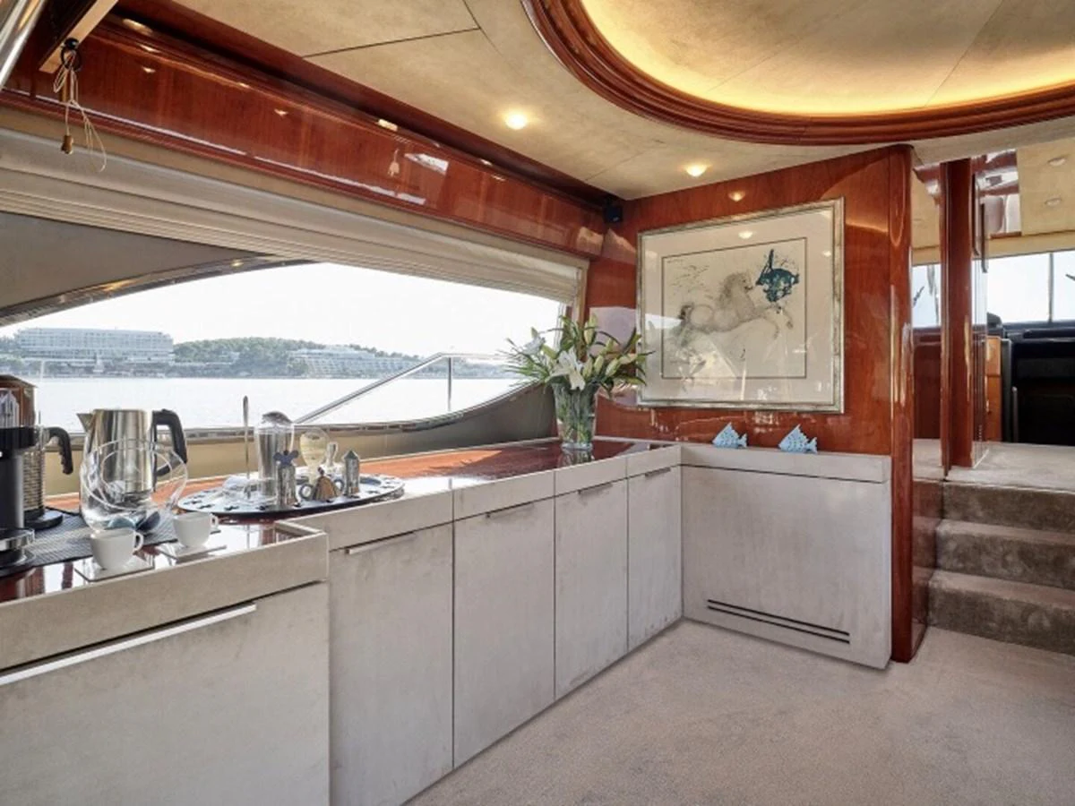 a kitchen with a large window aboard MIREN Yacht for Sale